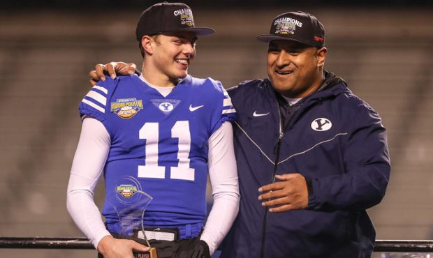 Quarterback Zach Wilson #11(MVP) and Head Coach Kalani Sitake of the BYU Cougars celebrate during t...
