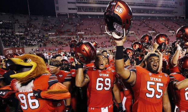 The Utah Utes celebrate following NCAA football against the Weber State Wildcats in Salt Lake City ...