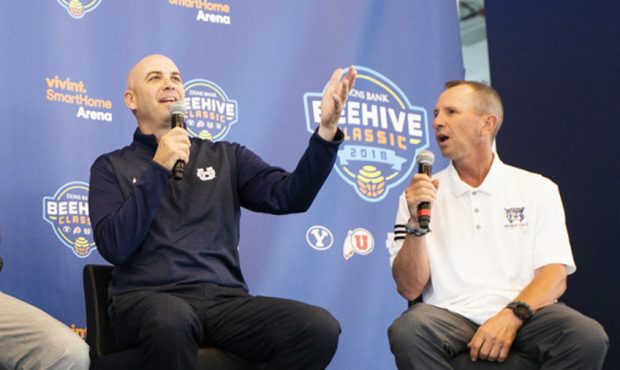 Craig Smith, Utah State, and Randy Rahe, Weber State, team up to promote the Beehive Classic at a p...