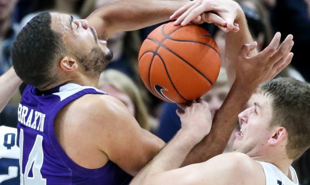 Weber State Wildcats forward Brenden Morris (34) and Utah State Aggies forward Quinn Taylor (10) co...