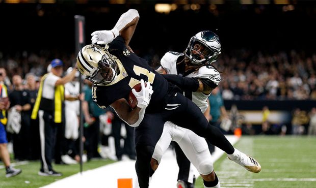 Alvin Kamara #41 of the New Orleans Saints is pushed out of bounds by Avonte Maddox #29 of the Phil...