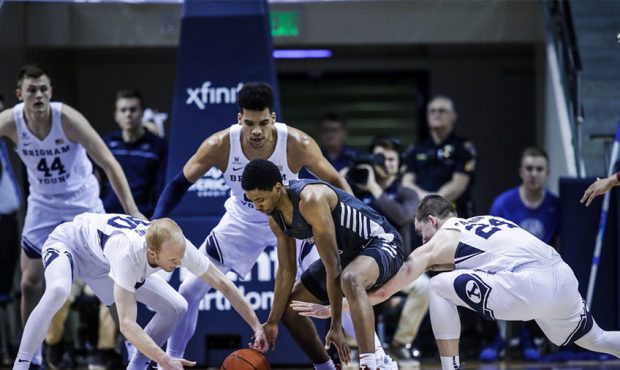 Players scramble for a loose ball during BYU's 80-74 win over Santa Clara in the Marriott Center in...