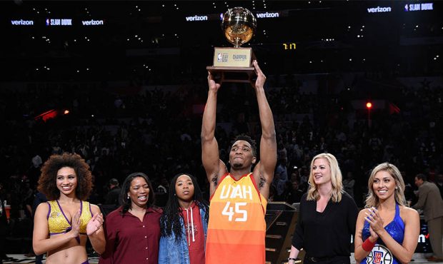 Donovan Mitchell #45 of the Utah Jazz accepts the 2018 Verizon Slam Dunk Contest trophy at Staples ...