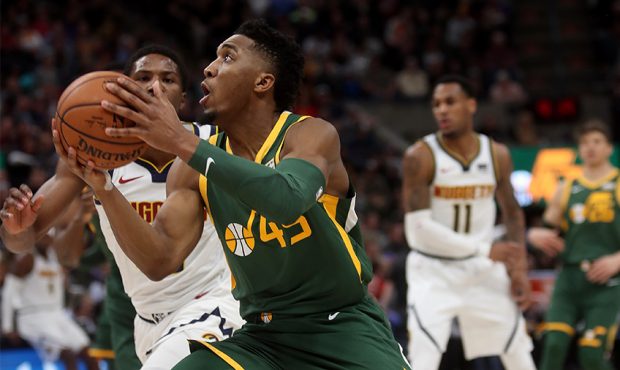 Utah Jazz guard Donovan Mitchell (45) drives to the hoop as the Jazz and the Nuggets play an NBA ba...