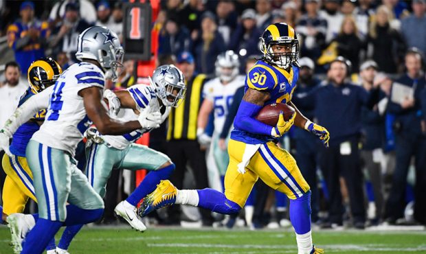 Running back Todd Gurley #30 of the Los Angeles Rams rushes for a touchdown in the second quarter a...