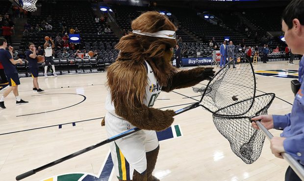 Jazz Bear catches a bat as it flew around the floor during warm ups for the Utah Jazz and Minnesota...
