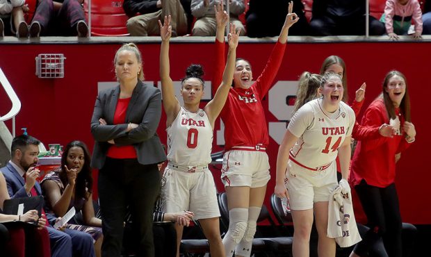Utah's bench celebrates after a 3-point shot as they and Colorado play at the Huntsman Center in Sa...