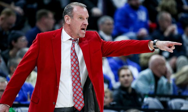 Utah Utes head coach Larry Krystkowiak calls out to players during the game against the Brigham You...