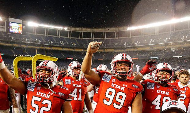 The Utah Utes chant along with fans following their loss to the Northwestern Wildcats in NCAA footb...