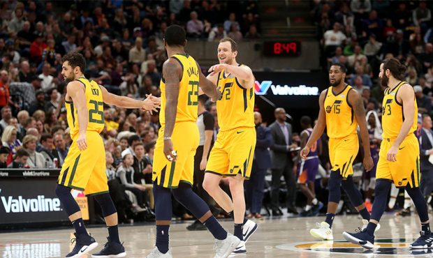 Jazz players walk off the floor at a timeout after a Utah Jazz forward Royce O'Neale (23) 3-point s...