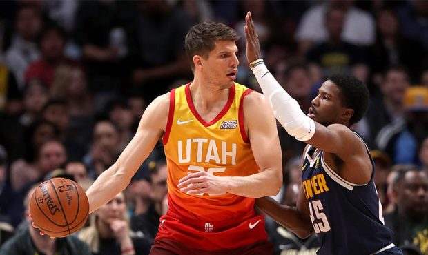 Kyle Korver #26 of the Utah Jazz is guarded by Malik Beasley #25 of the Denver Nuggets in the first...