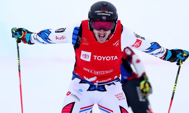 Francois Place of France celebrates after crossing the finish line to win the Men's Ski Cross Final...