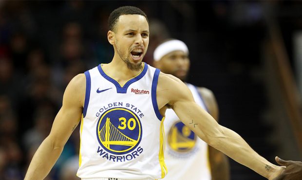 Stephen Curry #30 of the Golden State Warriors reacts after a play against the Charlotte Hornets du...