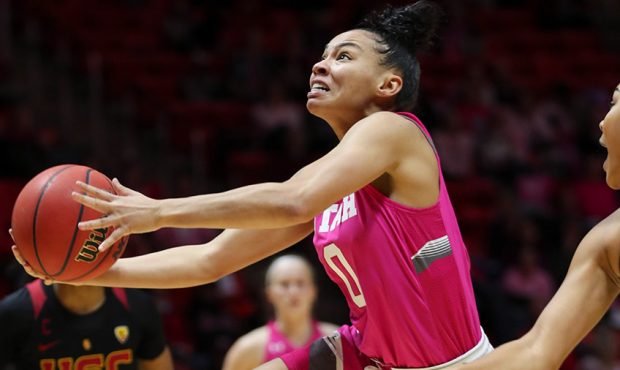 Utah Utes guard Kiana Moore (0) drives to the basket during the Utah versus USC women's basketball ...