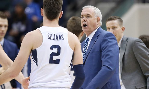 Brigham Young Cougars head coach Dave Rose talks with Brigham Young Cougars guard Zac Seljaas (2) i...