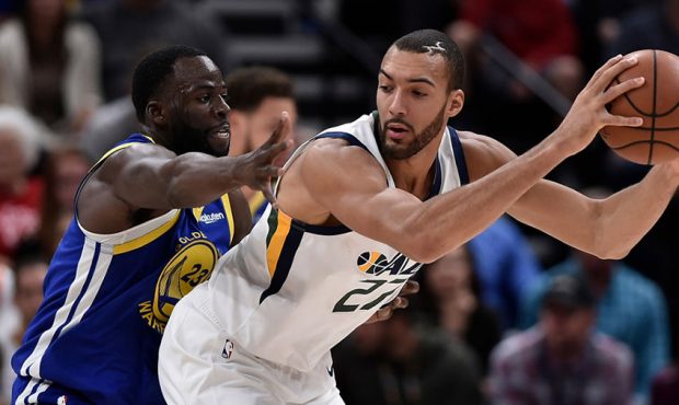 Draymond Green #23 of the Golden State Warriors defends against Rudy Gobert #27 of the Utah Jazz in...