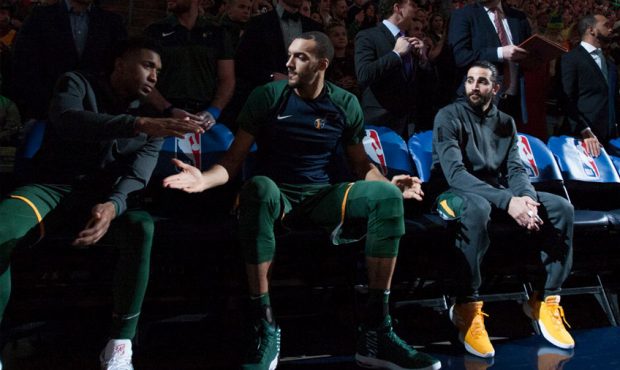 Donovan Mitchell #45, Rudy Gobert #27, and Ricky Rubio #3 of the Utah Jazz wait to be introduced be...