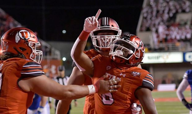 Armand Shyne #6 of the Utah Utes celebrates his winning touchdown in the second half of a game at R...