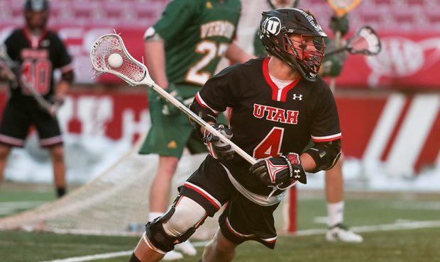 Utah's Jimmy Perkins turns around the Vermont net during a lacrosse game at Rice-Eccles Stadium in ...