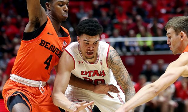Utah Utes forward Timmy Allen (20) its the the ball knocked away by Oregon State Beavers forward Tr...