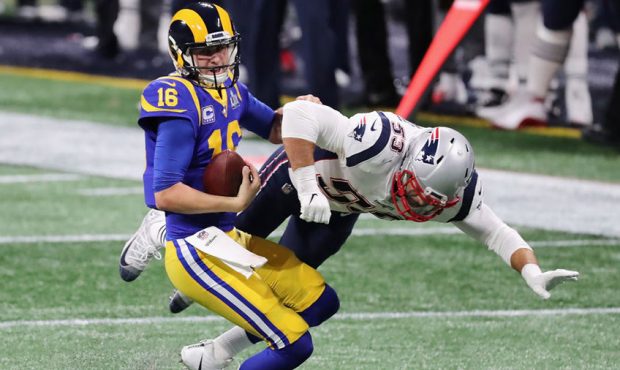 Kyle Van Noy #53 of the New England Patriots sacks Jared Goff #16 of the Los Angeles Rams in the fi...
