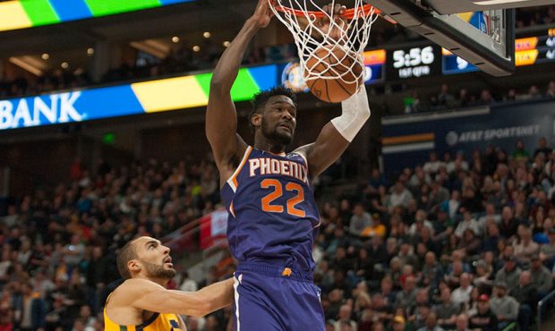 Deandre Ayton #22 of the Phoenix Suns slam dunks the ball over Rudy Gobert ##27 of the Utah Jazz du...