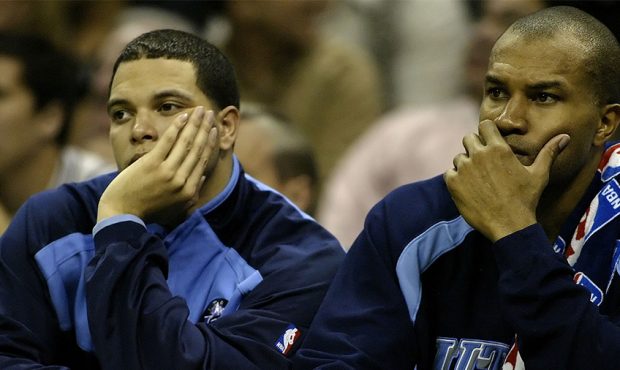 Deron Williams #8 and Derek Fisher #2 of the Utah Jazz sit on the bench in the fourth quarter again...