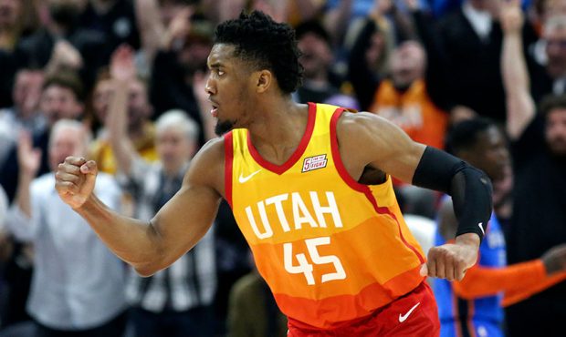 Utah Jazz guard Donovan Mitchell (45) reacts to getting a shot during an NBA basketball game agains...