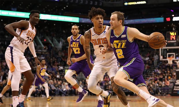 Joe Ingles #2 of the Utah Jazz drives the ball past Kelly Oubre Jr. #3 of the Phoenix Suns during t...