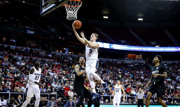 Utah State Aggies guard Sam Merrill (5) goes to the hoop during the Mountain West Conference finals...