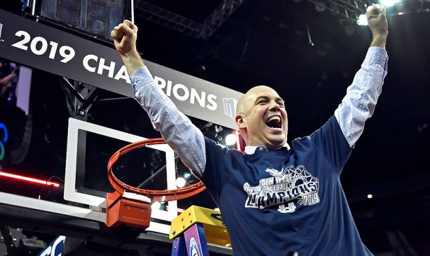 Head coach Craig Smith of the Utah State Aggies celebrates after his team defeated the San Diego St...