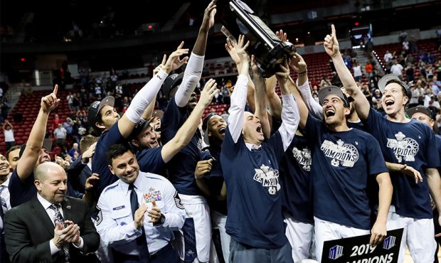 The Utah State Aggies celebrate their win over the San Diego State Aztecs in the Mountain West Conf...