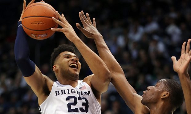 Brigham Young Cougars forward Yoeli Childs is fouled by Pacific Tigers forward Anthony Townes durin...