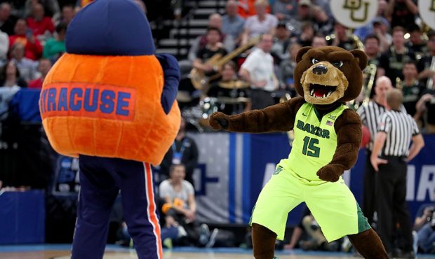 Otto the Orange, mascot for the Syracuse Orange, and the Baylor Bears mascot perform during the sec...