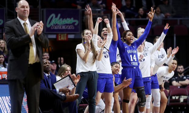 BYU's bench erupts after a three point shot by Brigham Young Cougars guard Brenna Chase (1) as BYU ...