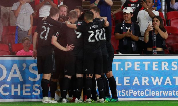 Paul Arriola #7 of D.C. United celebrates with his teammates after scoring a goal in the second hal...
