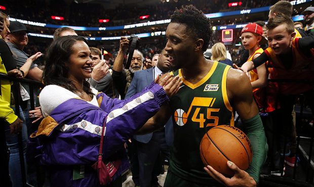 Utah Jazz guard Donovan Mitchell (45) greets his girlfriend Deja Lighty as the exits the floor afte...