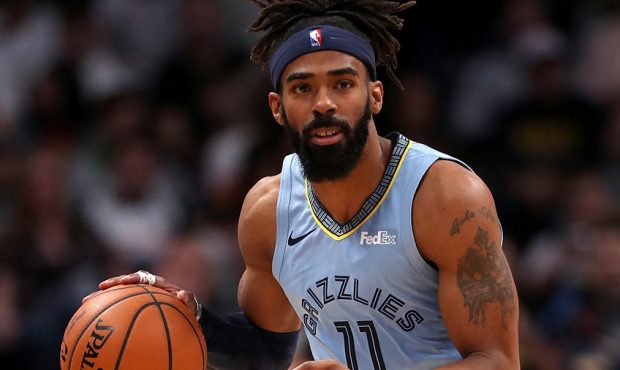 Mike Conley #11 of the Memphis Grizzlies plays the Denver Nuggets at the Pepsi Center on December 1...