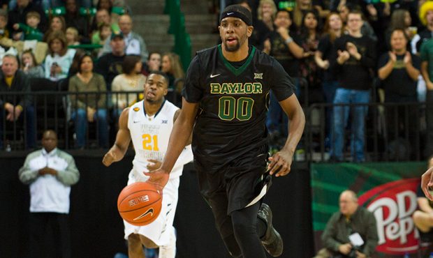 Royce O'Neale #00 of the Baylor Bears brings the ball up court against the West Virginia Mountainee...