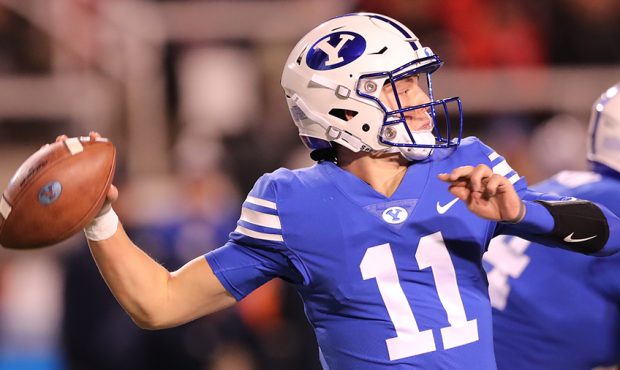 Brigham Young Cougars quarterback Zach Wilson (11) makes a pass as BYU and Utah play at Rice Eccles...