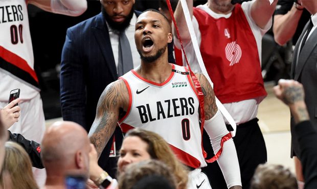 Damian Lillard #0 of the Portland Trail Blazers reacts after hitting the game winning shot in Game ...