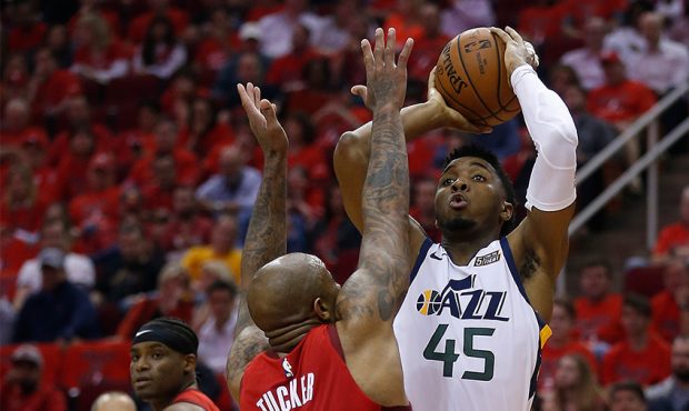 Donovan Mitchell #45 of the Utah Jazz shoots over PJ Tucker #17 of the Houston Rockets in the secon...