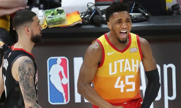 Utah Jazz guard Donovan Mitchell (45) celebrates a 3 during the NBA playoffs in Salt Lake City on S...