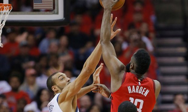 James Harden #13 of the Houston Rockets shoots over Rudy Gobert #27 of the Utah Jazz in the first h...