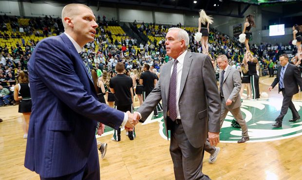 Utah Valley coach Mark Pope and BYU coach Dave Rose shake hands after the game in the UCCU center a...