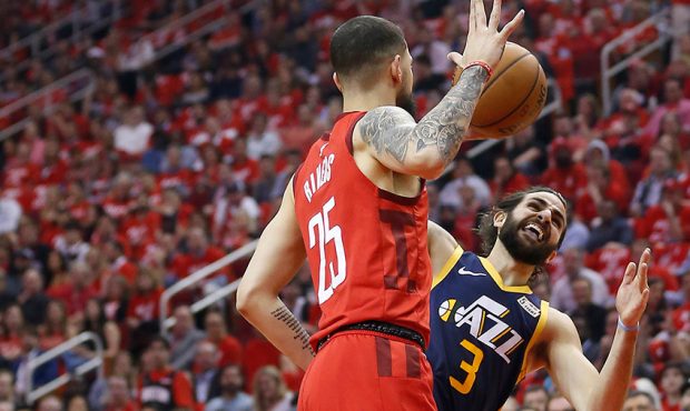 Ricky Rubio #3 of the Utah Jazz is fouled by Austin Rivers #25 of the Houston Rockets during Game T...