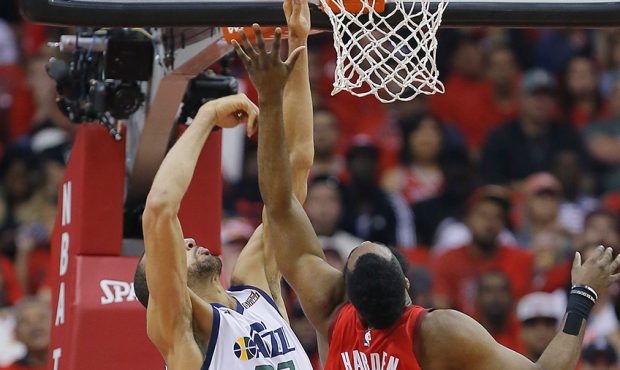 James Harden #13 of the Houston Rockets shoots over Rudy Gobert #27 of the Utah Jazz in the first q...