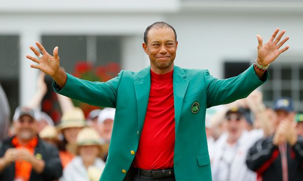 Tiger Woods of the United States reacts after being awarded the Green Jacket during the Green Jacke...