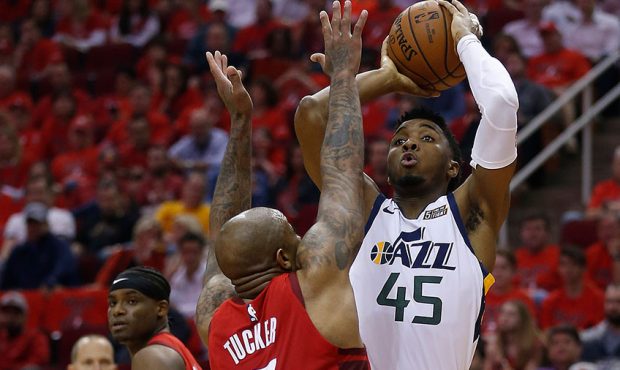 Donovan Mitchell #45 of the Utah Jazz shoots over PJ Tucker #17 of the Houston Rockets in the secon...