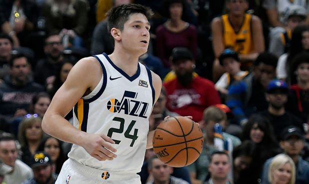 Grayson Allen #24 of the Utah Jazz brings the ball up court in a preseason NBA game against the Ade...